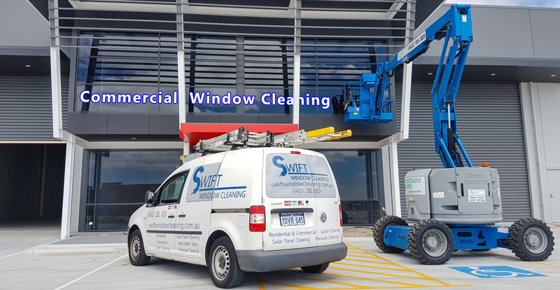Swift window cleaning van and elevated work platform in front of commercial building in Canning Vale
