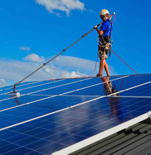 Professional Solar Panel Cleaning with pure water fed pole and safety harness